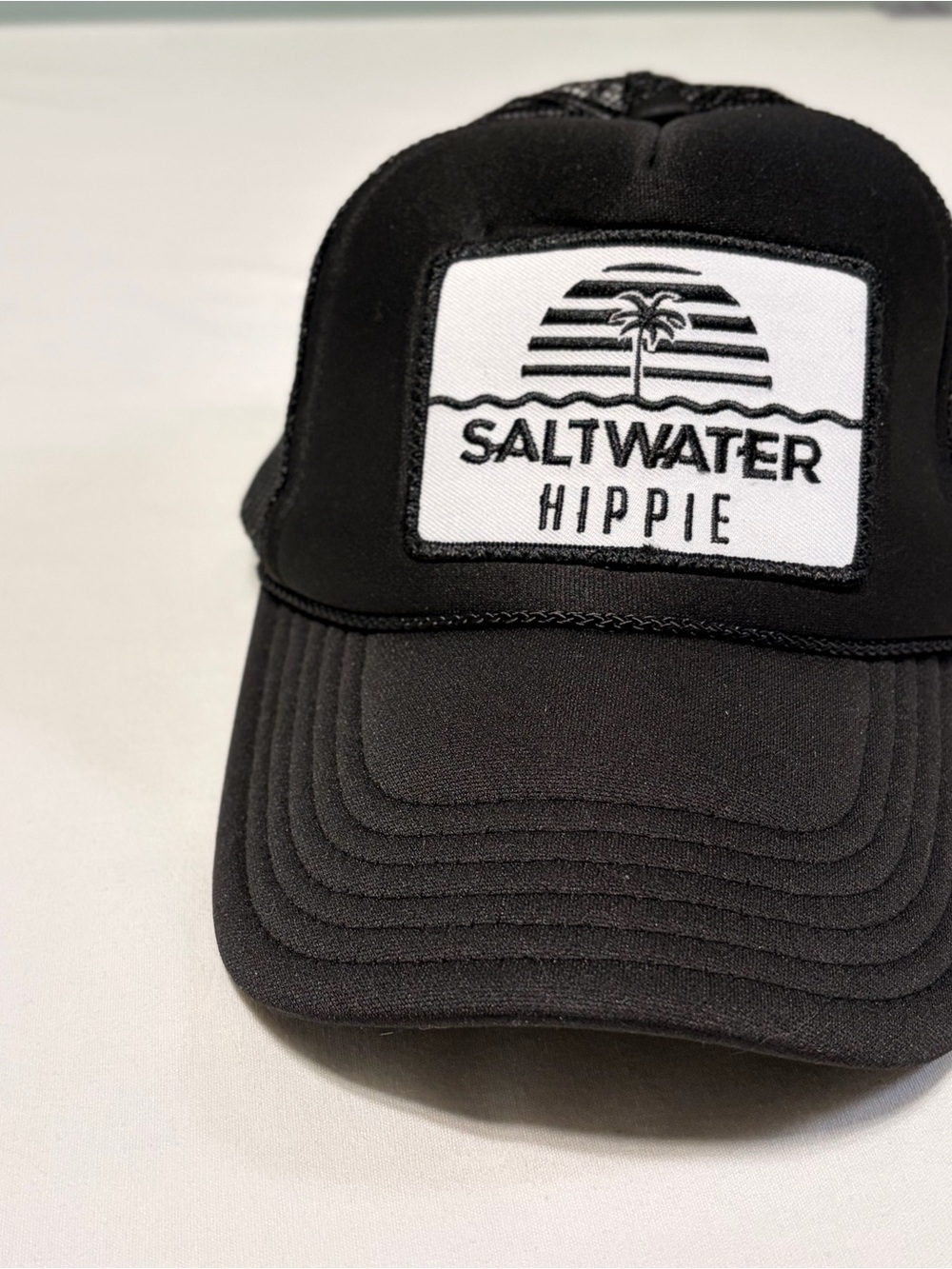 Saltwater Hippie black trucker snapback in excellent used condition. One Size